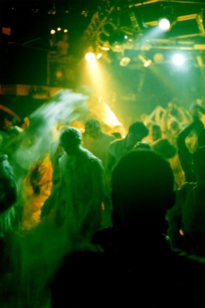 Seen from the crowd, the foam covers the dancers up to their shoulders.