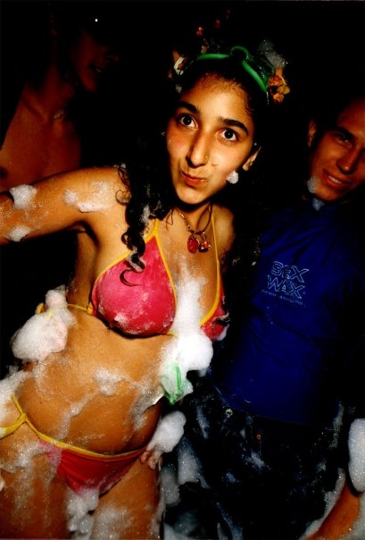 A dancer in a swimsuit in the foam, on the Fuse dance floor.