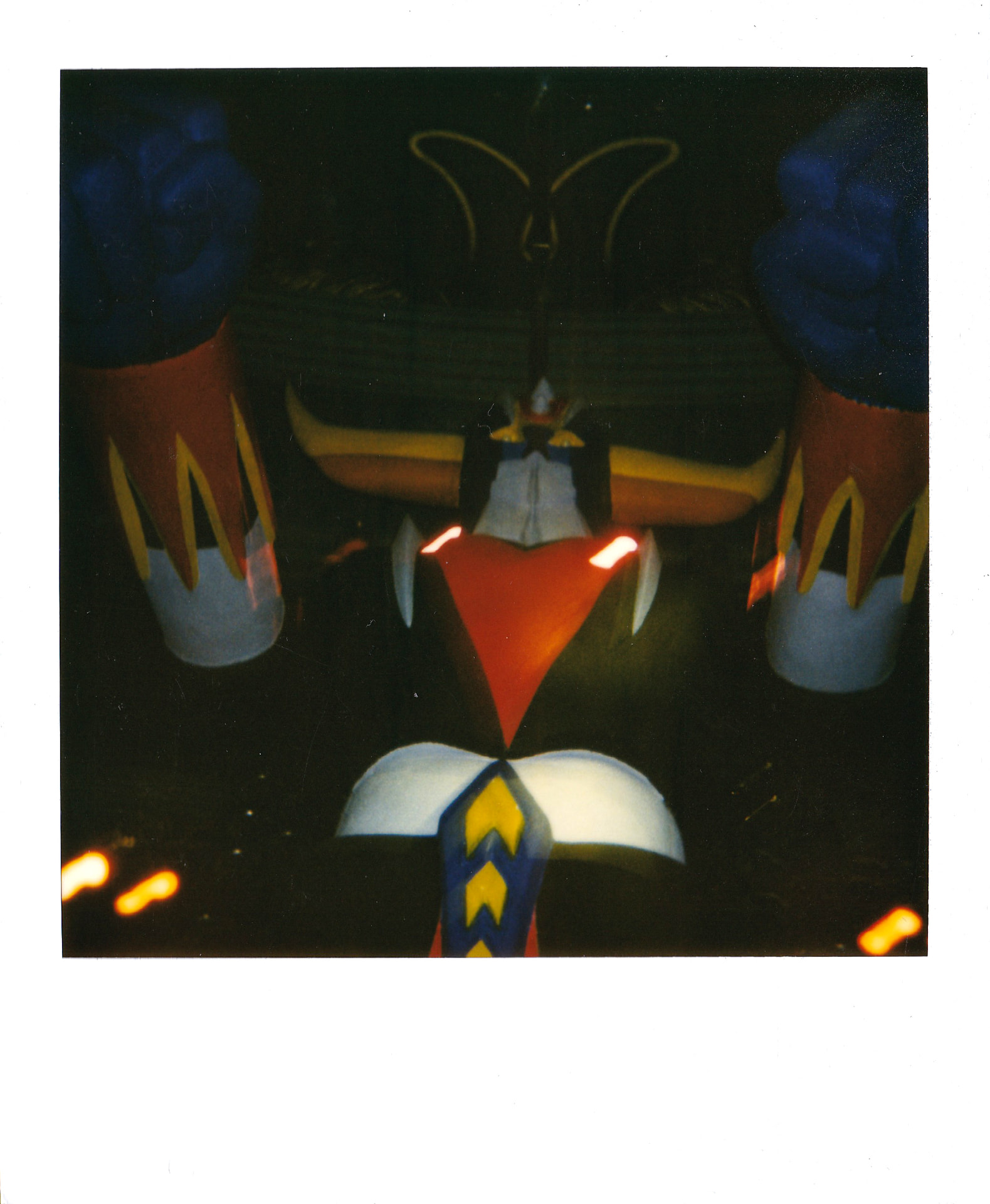 Close view of the torso and fists during a pyrotechnic cue.
