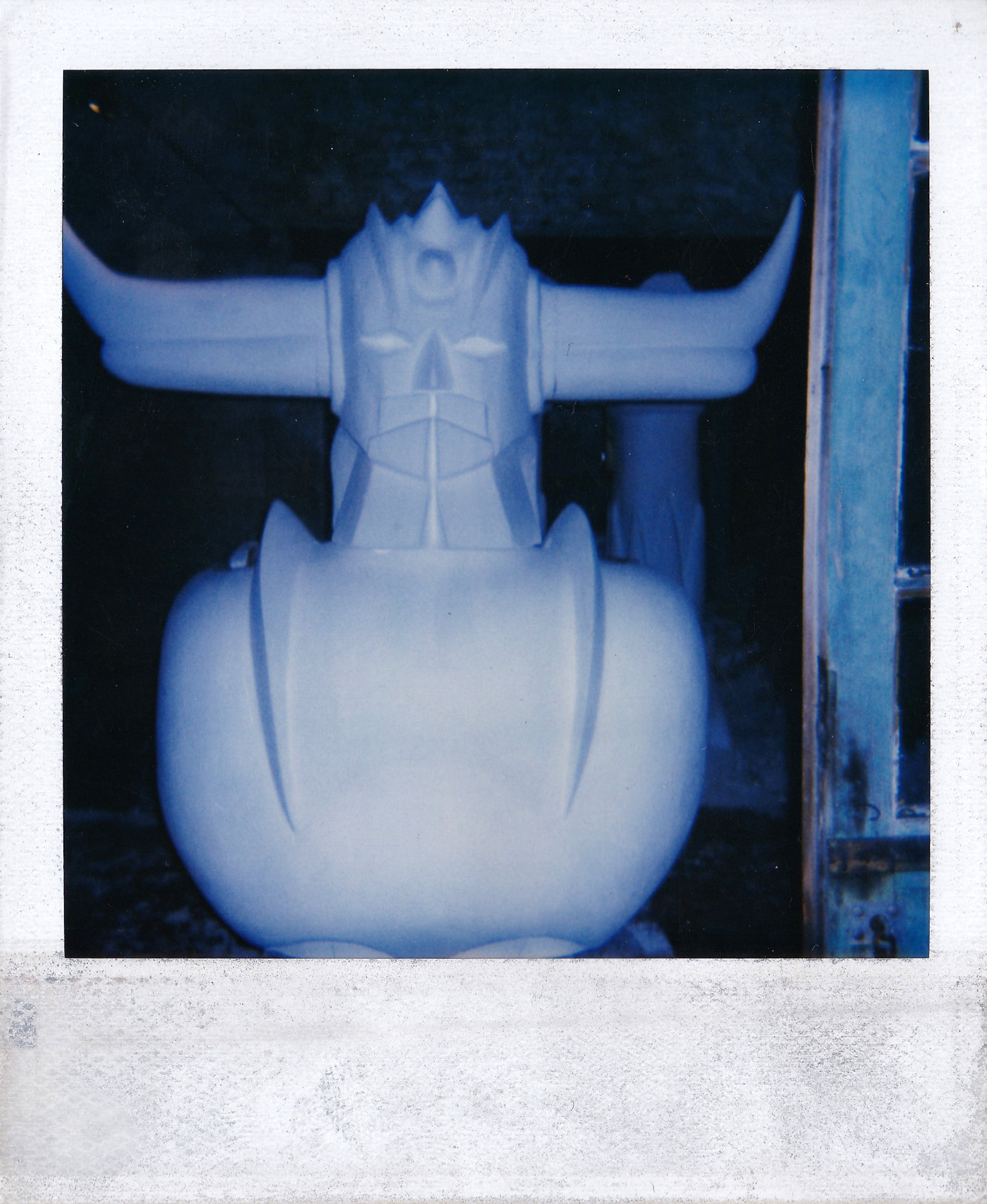 The torso and head assembled, wings and horns in position.