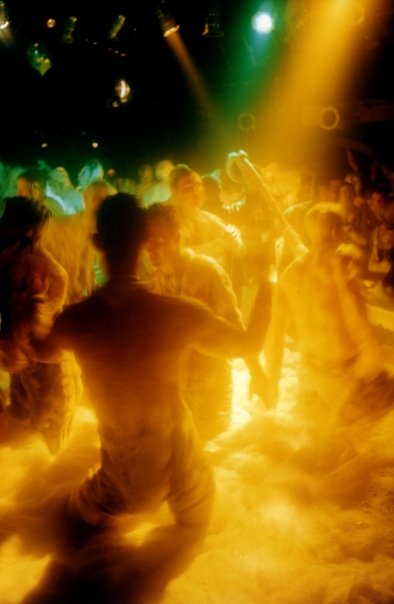 The floor drowned in foam, in the golden light of the spotlights.