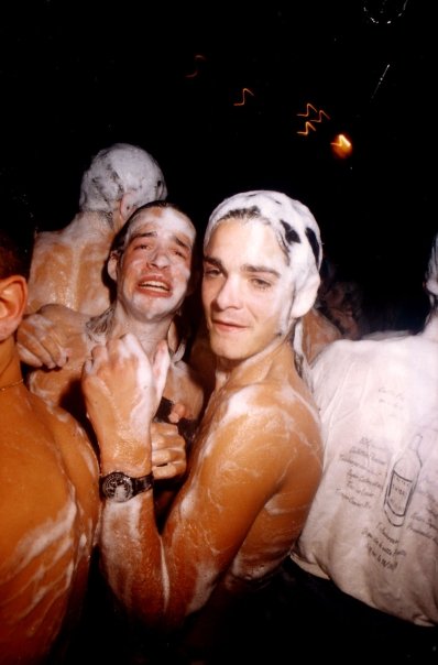 Two clubbers pose for the photographer, covered in foam.
