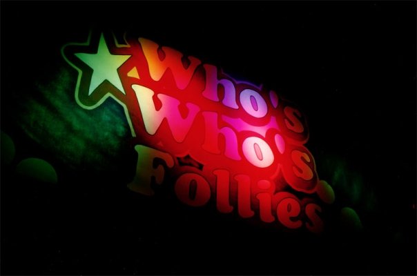 The Who's Who's Follies logo projected into the night.